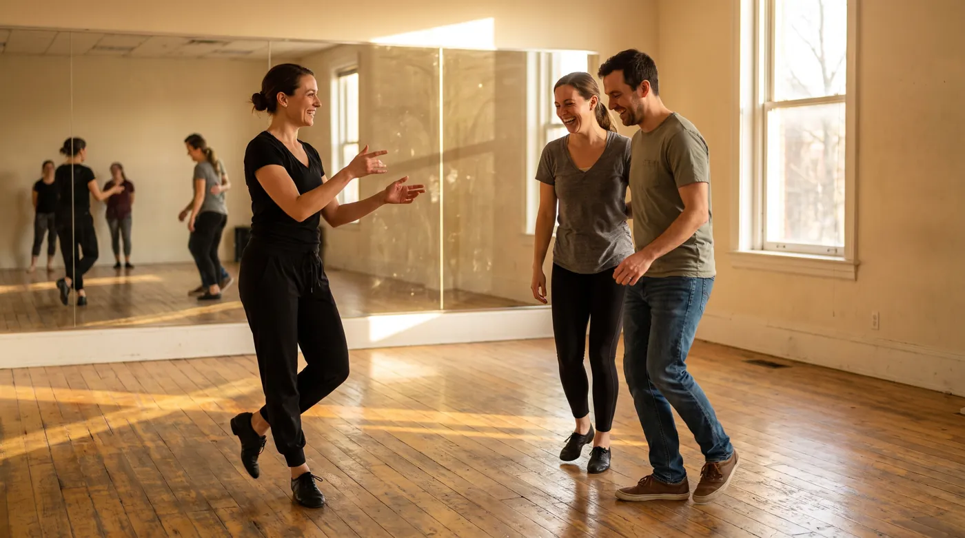 An instructor teaching a beginner couple their first steps in a sunlit studio.
